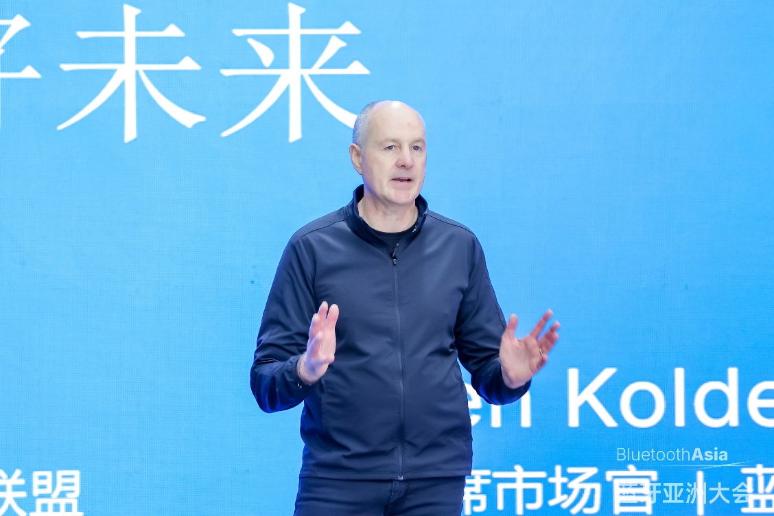 A person standing in front of a blue background AI-generated content may be incorrect.